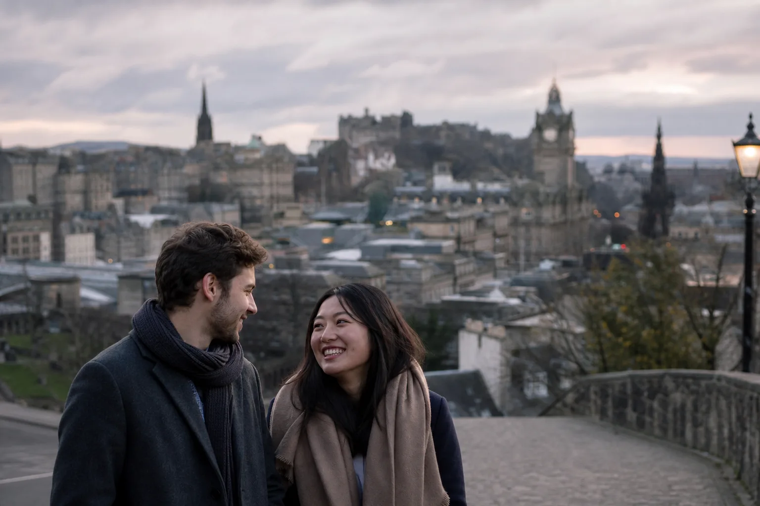 Two people talking over coffee beside an Edinburgh window
